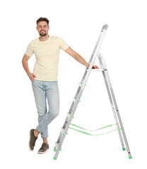 Young handsome man near metal ladder on white background