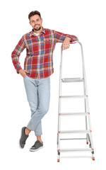 Young handsome man near metal ladder on white background
