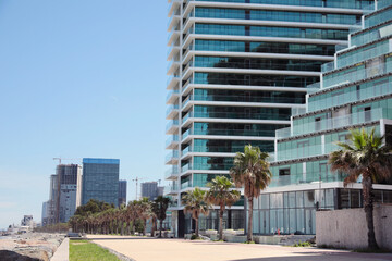 Obraz na płótnie Canvas Cityscape with modern buildings and palm trees