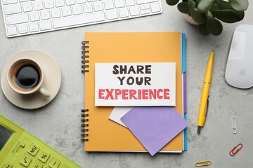 Share Your Experience. Flat lay composition with card, stationery and coffee on light table