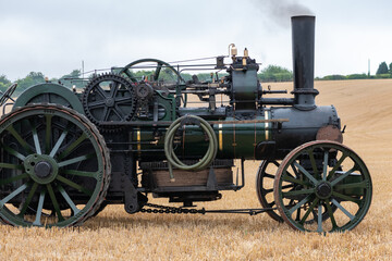 Fototapeta na wymiar A restored ploughing engine in a field