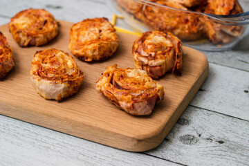 Homemade mini pizza buns topped with tomato sauce, ham and cheese