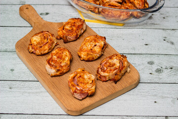 Homemade mini pizza buns topped with tomato sauce, ham and cheese