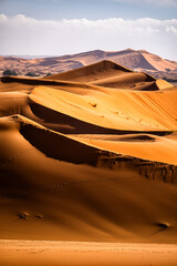 Fototapeta na wymiar Sahara Desert sand dunes background. Popular travel destination, Erg Chebbi, Sahara Desert, Morocco.