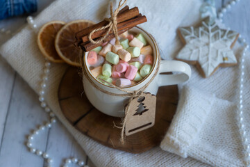 A cup of hot coffee, zifirki, sweets and Christmas decorations on a wooden table. Calendar for New...