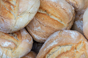 closeup of large loaves of bread freshly baked in an artisanal way