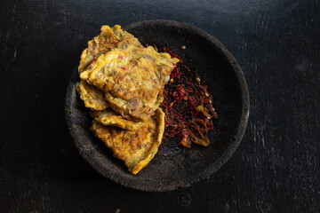Omelet served with red chili sauce