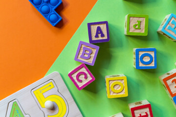 Wooden toys, blocks with abc, with numbers. Preschool, elementary school education. Development games for kids. Educational daycare toys.	