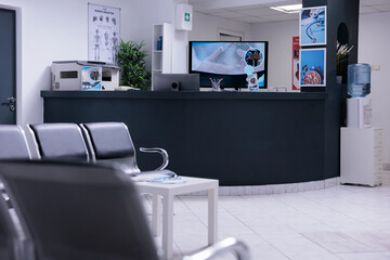 Nobody in hospital reception desk and waiting room at facility to attend medical consultation...