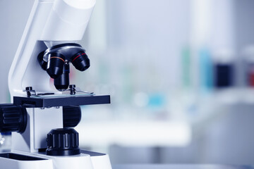 Modern medical microscope in laboratory, closeup. Space for text