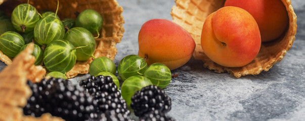 background of berries and waffle cups on the table