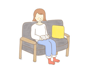 ソファで本を読む女性