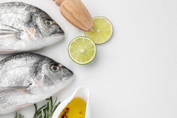 Fresh dorado fish and ingredients on white table, flat lay. Space for text