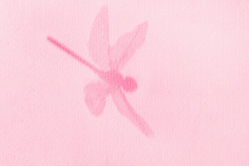 Dragonfly in flight close-up, shadow on wall toned into Viva Magenta color. Soft pastel background