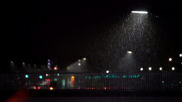 
Tokyo,Japan - December 6, 2022: Bridge and Street light in the heavy rain in the night
