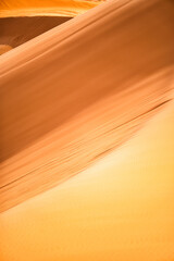Desert sand dunes close-up background. Sahara Desert, Erg Chebbi, Morocco.