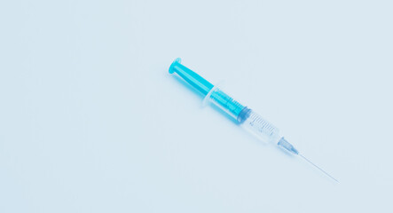 Medical syringe on a white background. A syringe for injection. The concept of health and beauty