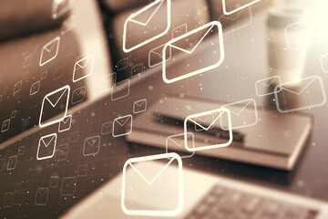 Double exposure of postal envelopes hologram on laptop background. Electronic mail and spam concept