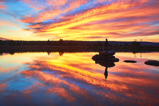 alone man in middle of a lake in an amazing sunset, gamboas lagoon in monte escobedo zacatecas 