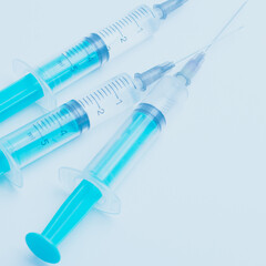 Medical syringe on a white background. A syringe for injection. The concept of health and beauty