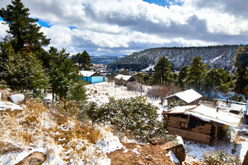 village in winter with snow covering all around, creel chihuahua  - obrazy, fototapety, plakaty
