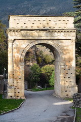 Fototapeta na wymiar Susa, Piedmont, Italy -10-22-2022- The Roman triumphal arch in honor of Octavian Augustus datable to the 1st century AD