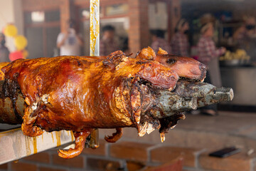 Guinea pigs (cuy) cooked on grill and ready for sale at the open market. Traditional food in Ecuador	