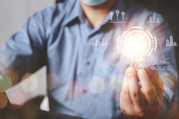 Businessman Hand holding Light bulb Global Internet connection. Business global internet connection application technology and digital marketing, Financial and banking, Digital link tech, big data.