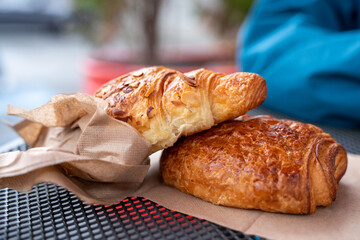 Almond and Chocolate Croissant outside at a cafep