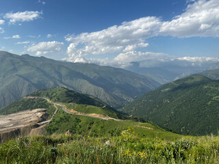 Naklejka na ściany i meble Beautiful mountain range with green valleys near Meghri Pass in Armenia