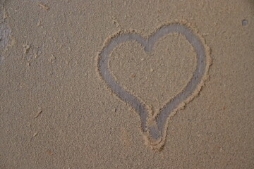 Heart drawn in the dust. Ideal for romantic neutral background.