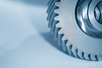 Close-up scene of transmission  gear spare parts in the light blue scene.