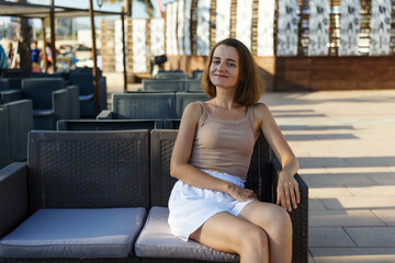 Portrait of a young stylish woman in a cafe