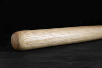Baseball bat on black background. Sports equipment