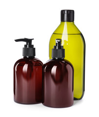 Different bottles of shampoo on white background