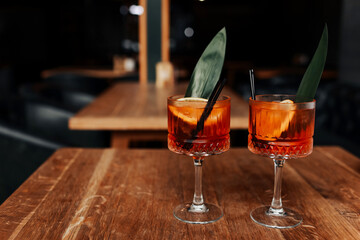 cocktail Aperol spritz in glasses. Cocktail aperol spritz decorated fresh orange slices, ice,...