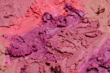 Texture of beautiful lipsticks as background, closeup
