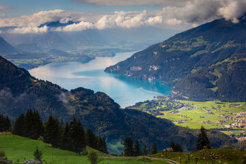 Aerial view of Swiss Alps and Lake Thun at dramatic sunset, Interlaken