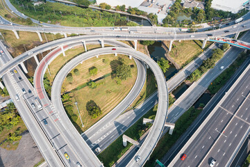 Multilevel junction motorway top view, Road traffic an important infrastructure in Thailand.Expressway Road and Roundabout. Transportation and travel concept.