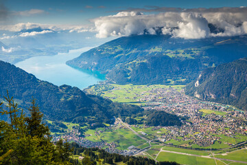 Aerial view of Swiss Alps and Lake Thun at dramatic sunset, Interlaken