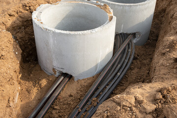 Digital telecommunication network pipe covered cables are buried underground. A large number of electric and high-speed Network cables on Construction site