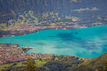 Aerial view of Swiss Alps and Lake Brienz with ferry boat at sunset, Interlaken
