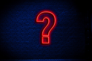 neon question mark sign attatched to the wall