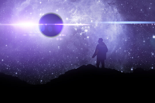 a silhouette of a person standing on top of mountain and watch the sky galaxy. elements of this image furnished by nasa