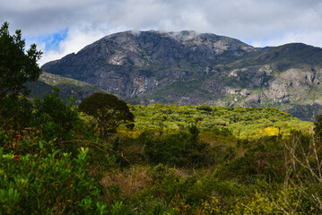 Fototapeta na wymiar Rugged mountains and lush vegetation in the Caraça Natural Park, Santuário do Caraça, Catas Altas, Minas Gerais state, Brazil