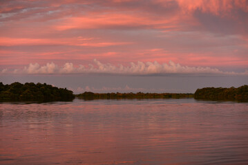 Fototapeta na wymiar Pink twilight on the Guaporé - Itenez river, from the remote, riverside village of Versalles, Beni Department, Bolivia, on the border with Rondonia state, Brazil