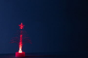 Christmas trees with lights, colored lights, decorations and christmas ornaments