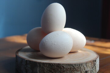 some raw free-range chicken eggs on the table