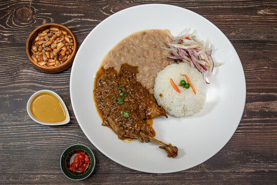 white beans with chicken and beef, served with rice and red onion seasoned