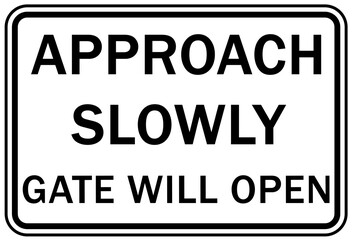 Fototapeta premium Automatic gate warning sign and label approach slowly automatic gate will open